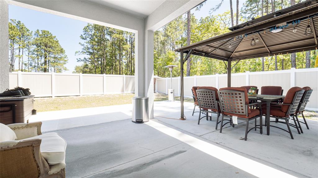 8007 Southwest 135th Loop Ocala, FL 34473 - Photo 39 of 47 a view of a dining room with furniture window and outside view
