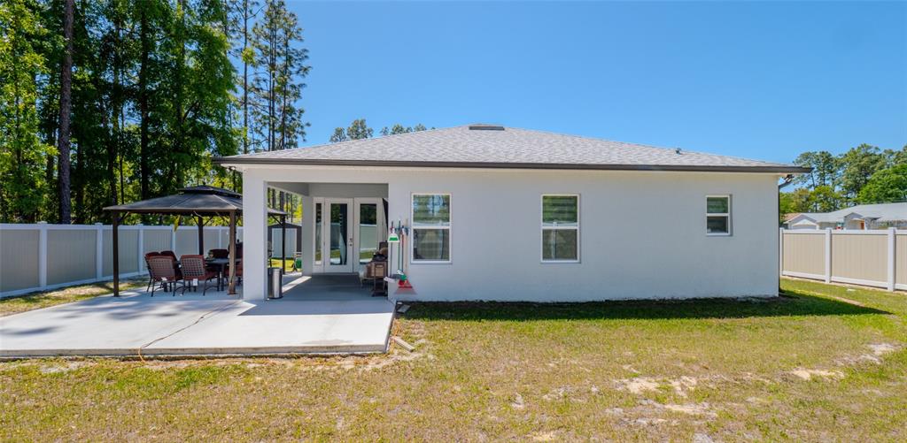 8007 Southwest 135th Loop Ocala, FL 34473 - Photo 41 of 47 a view of a house with backyard porch and sitting area