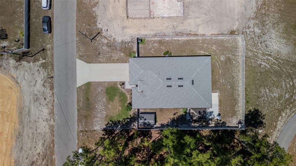 8007 Southwest 135th Loop Ocala, FL 34473 - Photo 6 of 47 an aerial view of a house with outdoor space