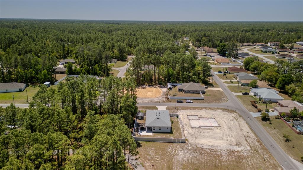 8007 Southwest 135th Loop Ocala, FL 34473 - Photo 7 of 47 an aerial view of residential houses with outdoor space