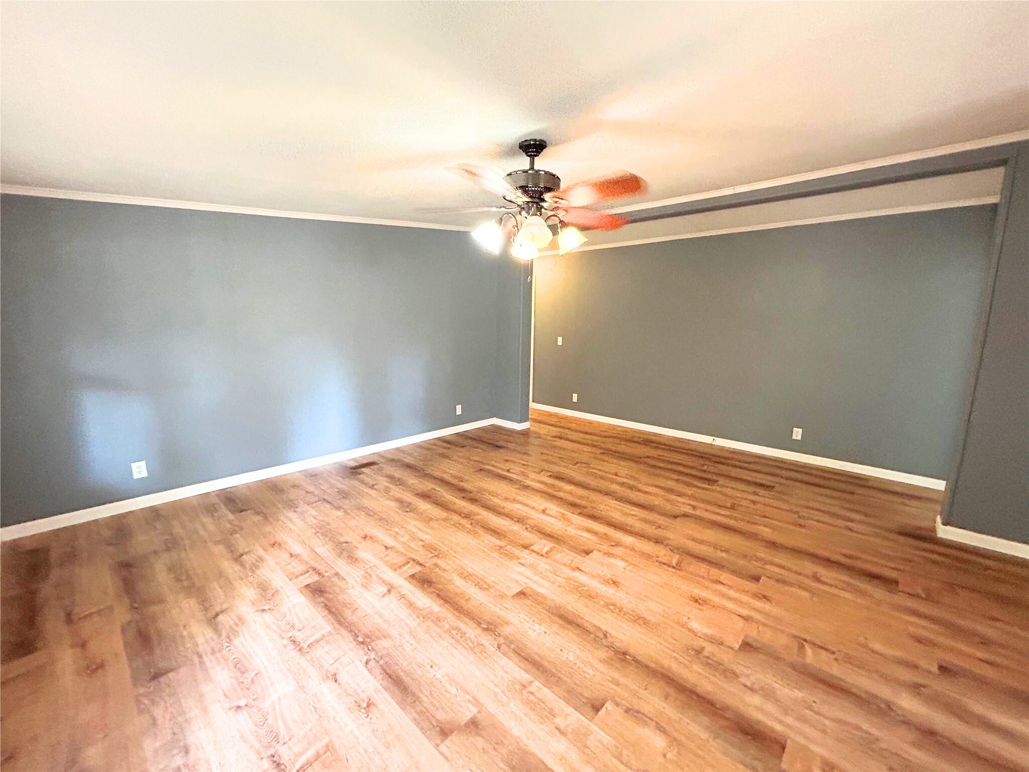 772 County Road 2191 Cleveland, TX 77327 - Photo 11 of 24 a view of a big room with wooden floor