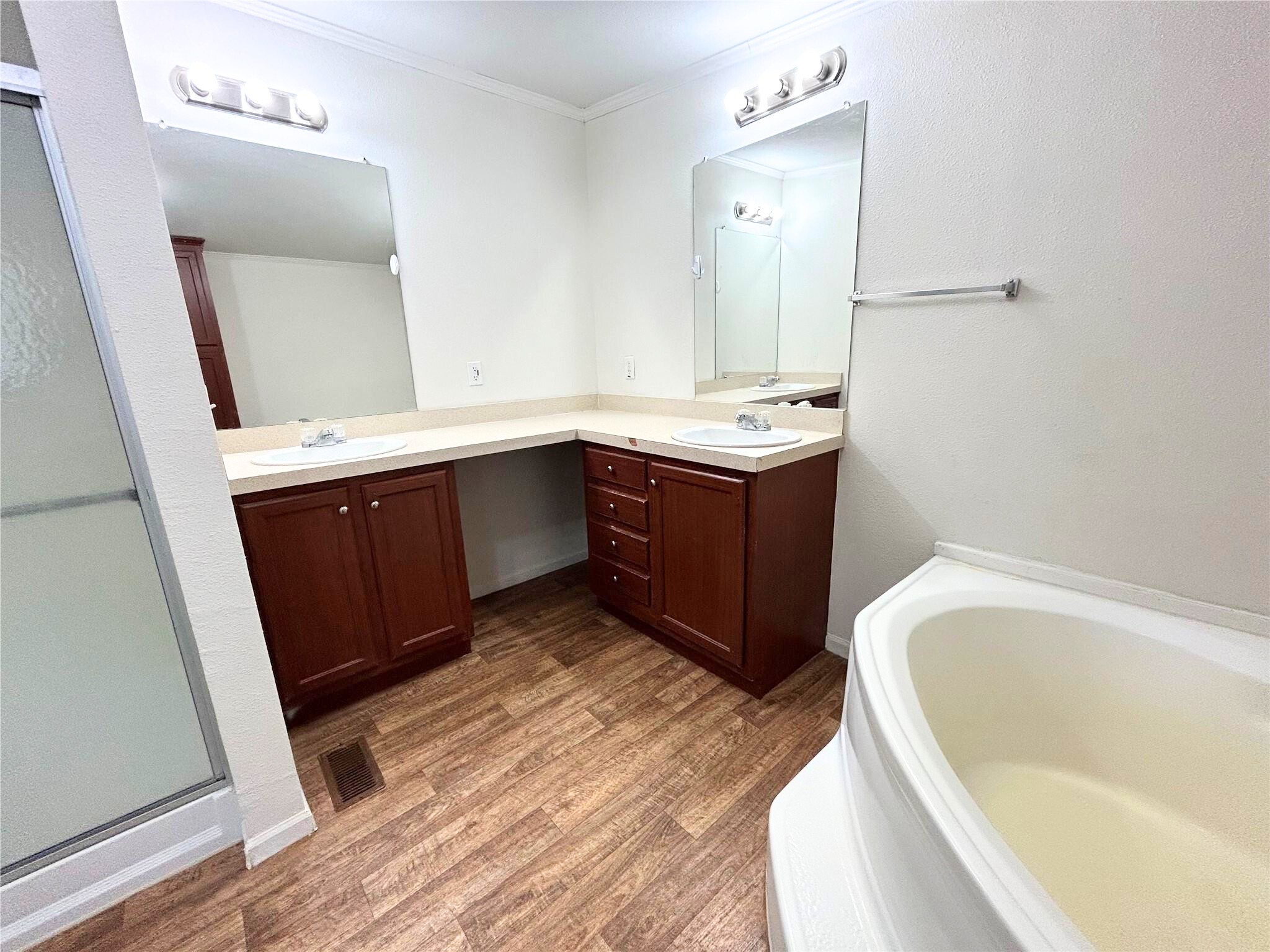 772 County Road 2191 Cleveland, TX 77327 - Photo 18 of 24 a bathroom with a tub sink and mirror