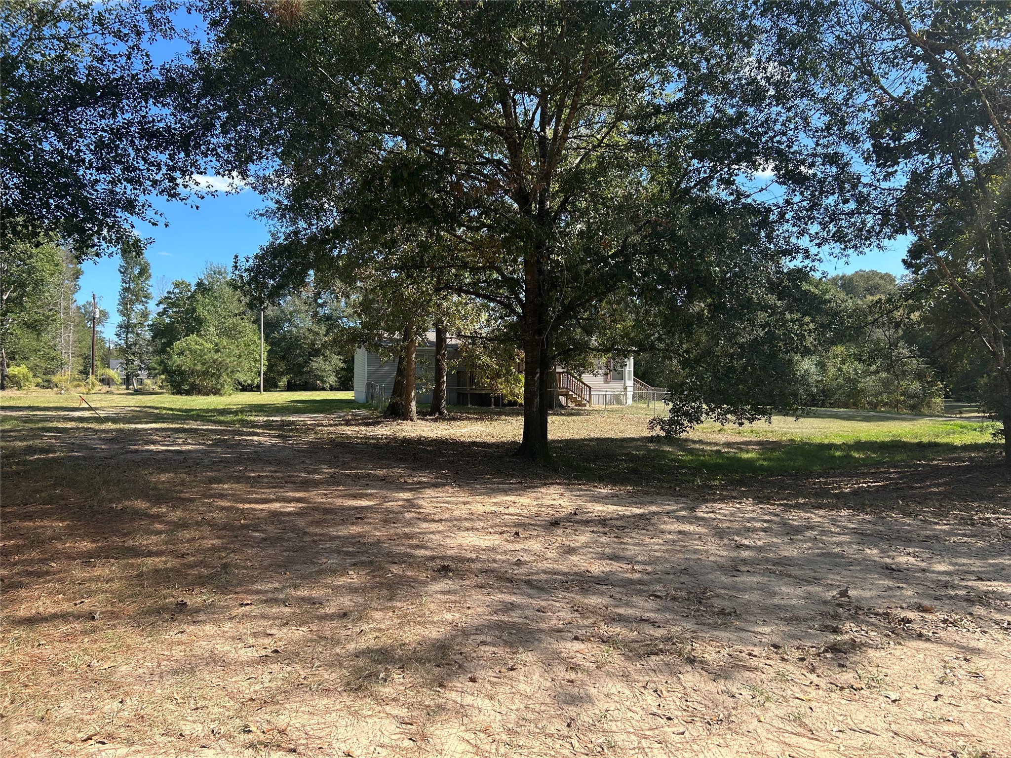 772 County Road 2191 Cleveland, TX 77327 - Photo 2 of 24 a view of a yard