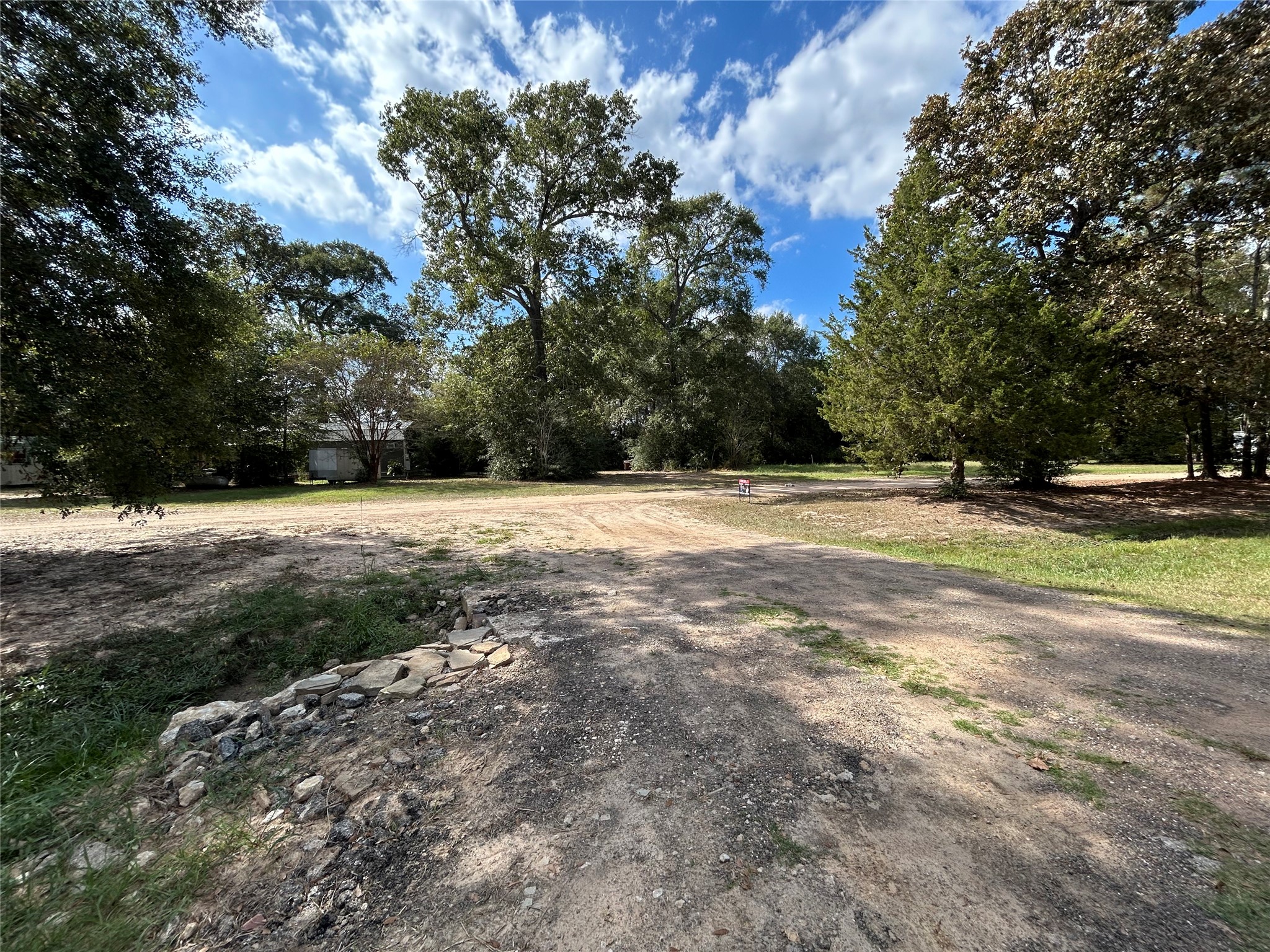 772 County Road 2191 Cleveland, TX 77327 - Photo 22 of 24 a view of a field with trees in the background