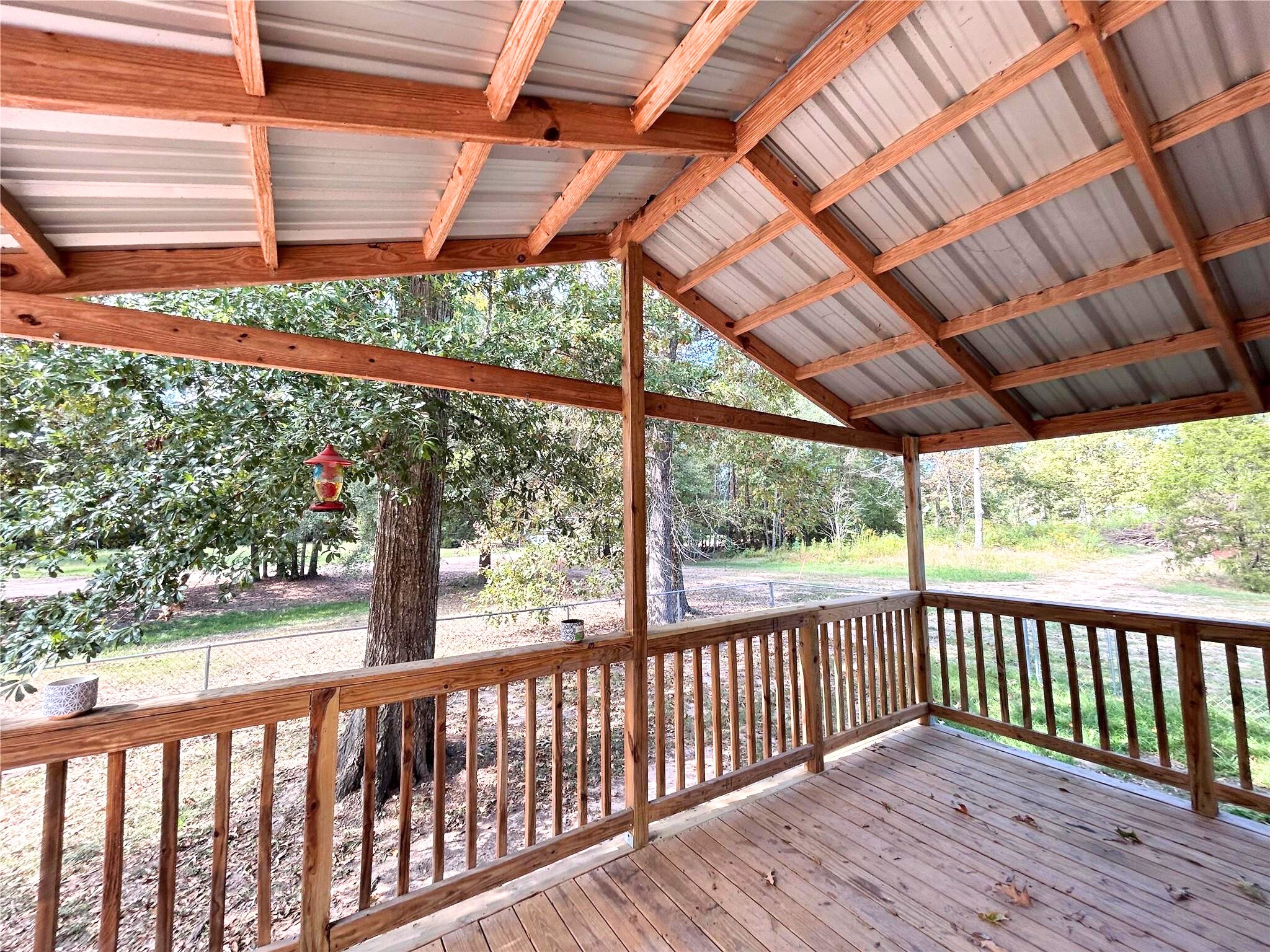772 County Road 2191 Cleveland, TX 77327 - Photo 6 of 24 a view of a wooden deck next to a yard