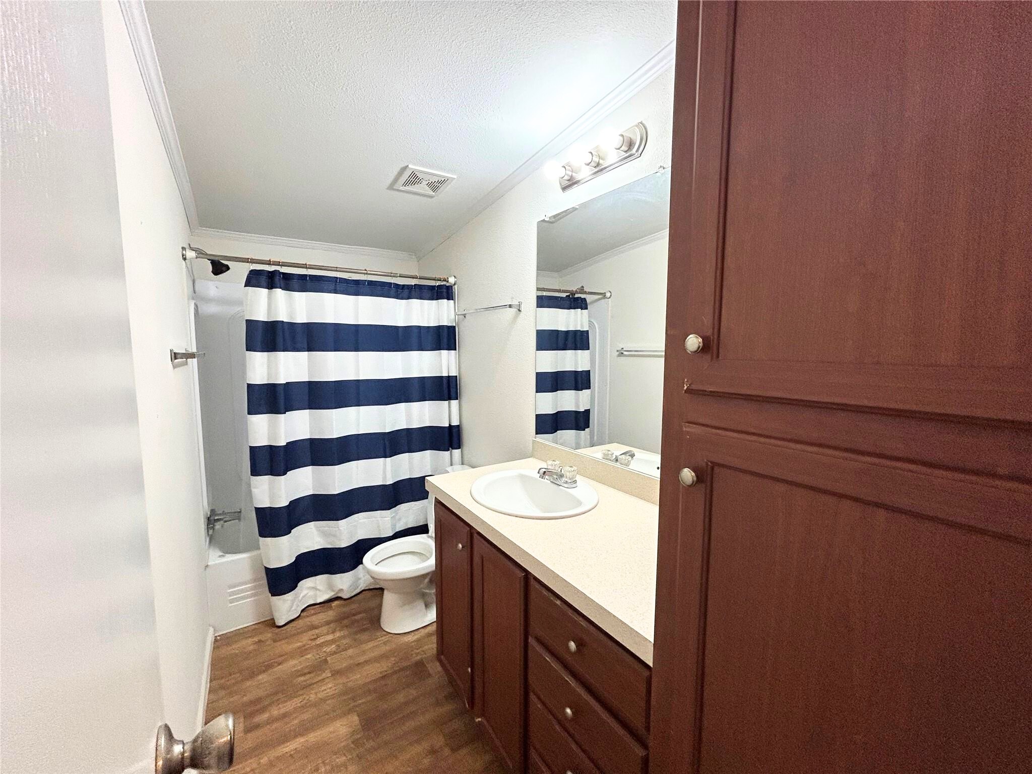 772 County Road 2191 Cleveland, TX 77327 - Photo 10 of 24 a bathroom with a sink a toilet and shower