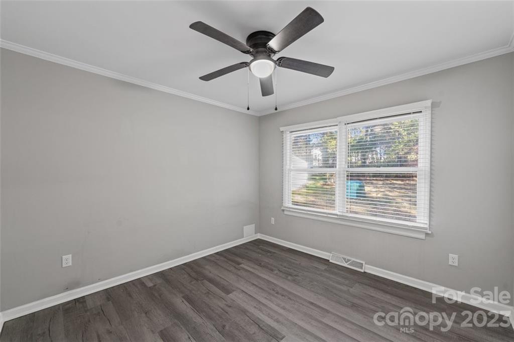 328 Sundown Road Mooresville, NC 28117 - Photo 24 of 32 a view of an empty room with wooden floor and a window