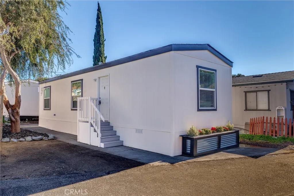 1255 Orcutt Road, Unit B14 San Luis Obispo, CA 93401 - Photo 1 of 11 a backyard of a house with wooden fence and large windows