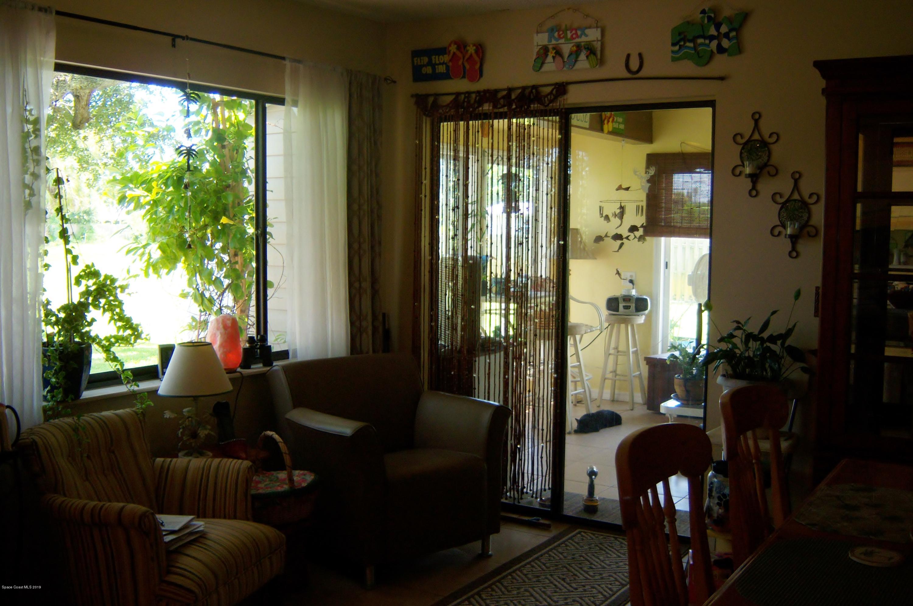 1556 Creel Road Northeast Palm Bay, FL 32905 - Photo 13 of 23 Dining area with access to back porch