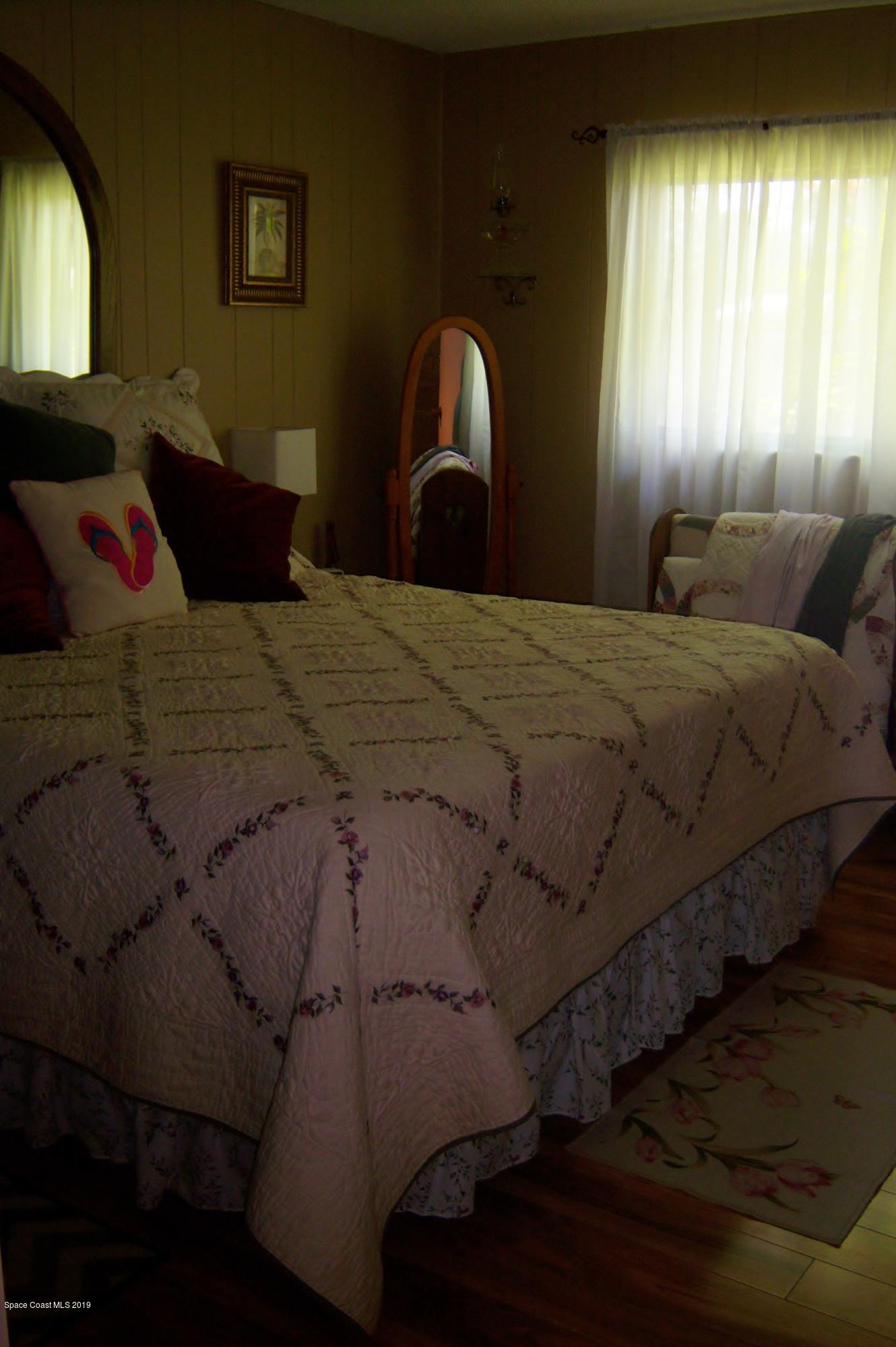 1556 Creel Road Northeast Palm Bay, FL 32905 - Photo 15 of 23 Master bedroom