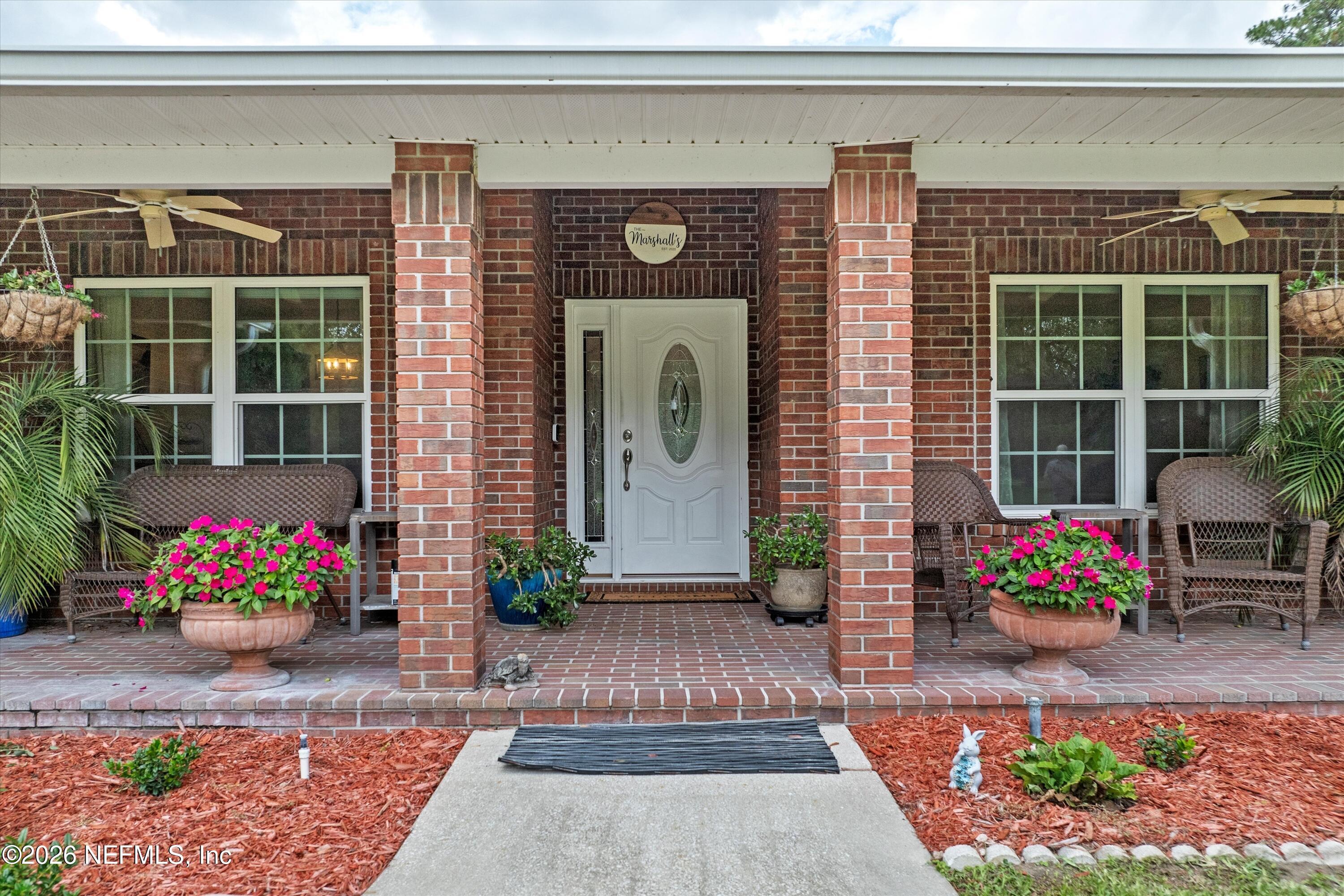 5566 Don Manuel Road Elkton, FL 32033 - Photo 5 of 47 a front view of a house with an outdoor space