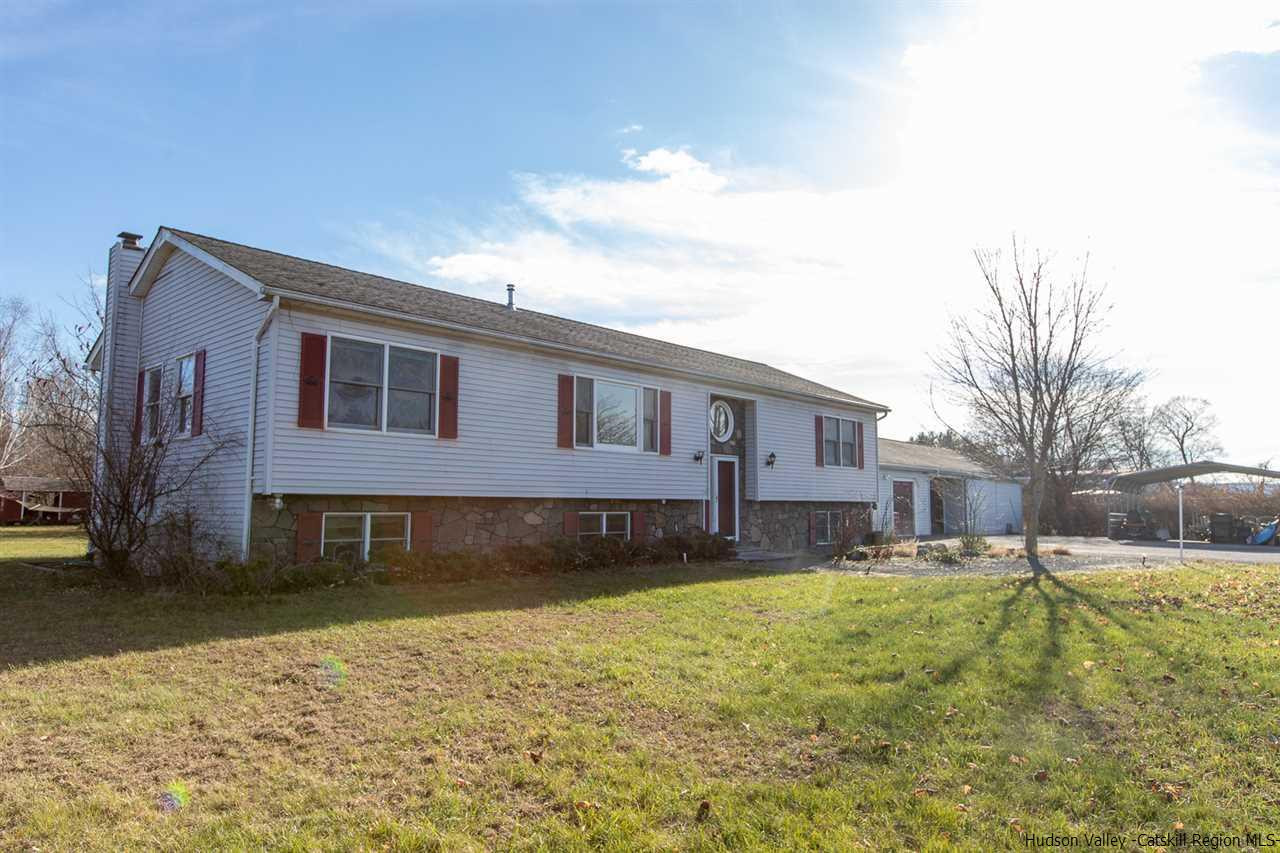 225 Pine Bush Road Stone Ridge, NY 12484 - Photo 1 of 29 a front view of a house with a yard