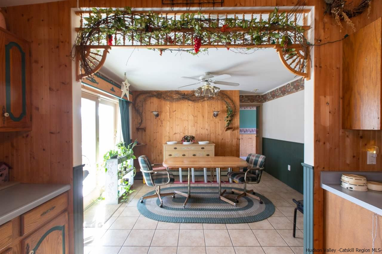225 Pine Bush Road Stone Ridge, NY 12484 - Photo 8 of 29 a dining room with furniture and a window
