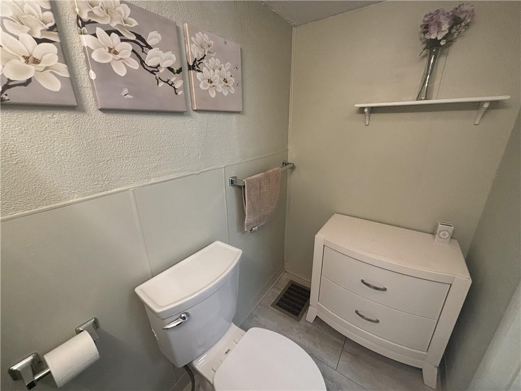 100 Spruce Street Rillton, PA 15678 - Photo 14 of 43 a white toilet sitting next to a white wall