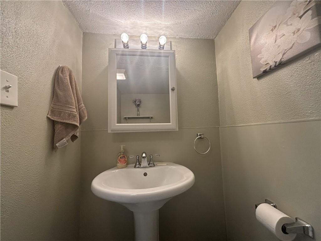 100 Spruce Street Rillton, PA 15678 - Photo 15 of 43 a bathroom with a sink toilet and mirror