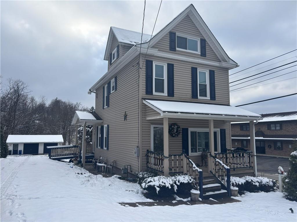 100 Spruce Street Rillton, PA 15678 - Photo 2 of 43 a front view of a house with yard outdoor seating and garage