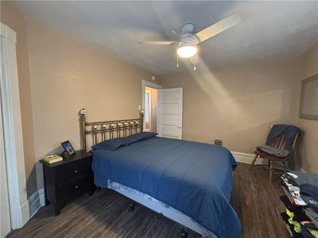 100 Spruce Street Rillton, PA 15678 - Photo 26 of 43 a bedroom with a bed and wooden floor