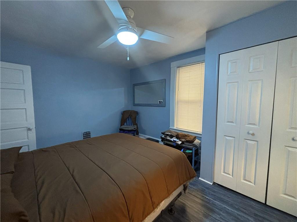 100 Spruce Street Rillton, PA 15678 - Photo 27 of 43 a bedroom with a bed and a chandelier