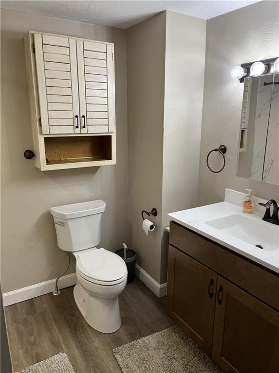 100 Spruce Street Rillton, PA 15678 - Photo 30 of 43 a bathroom with a toilet a sink and mirror