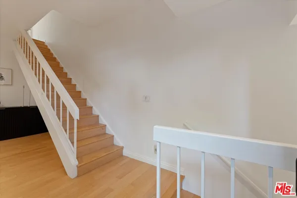 a bedroom with a bed and a chair