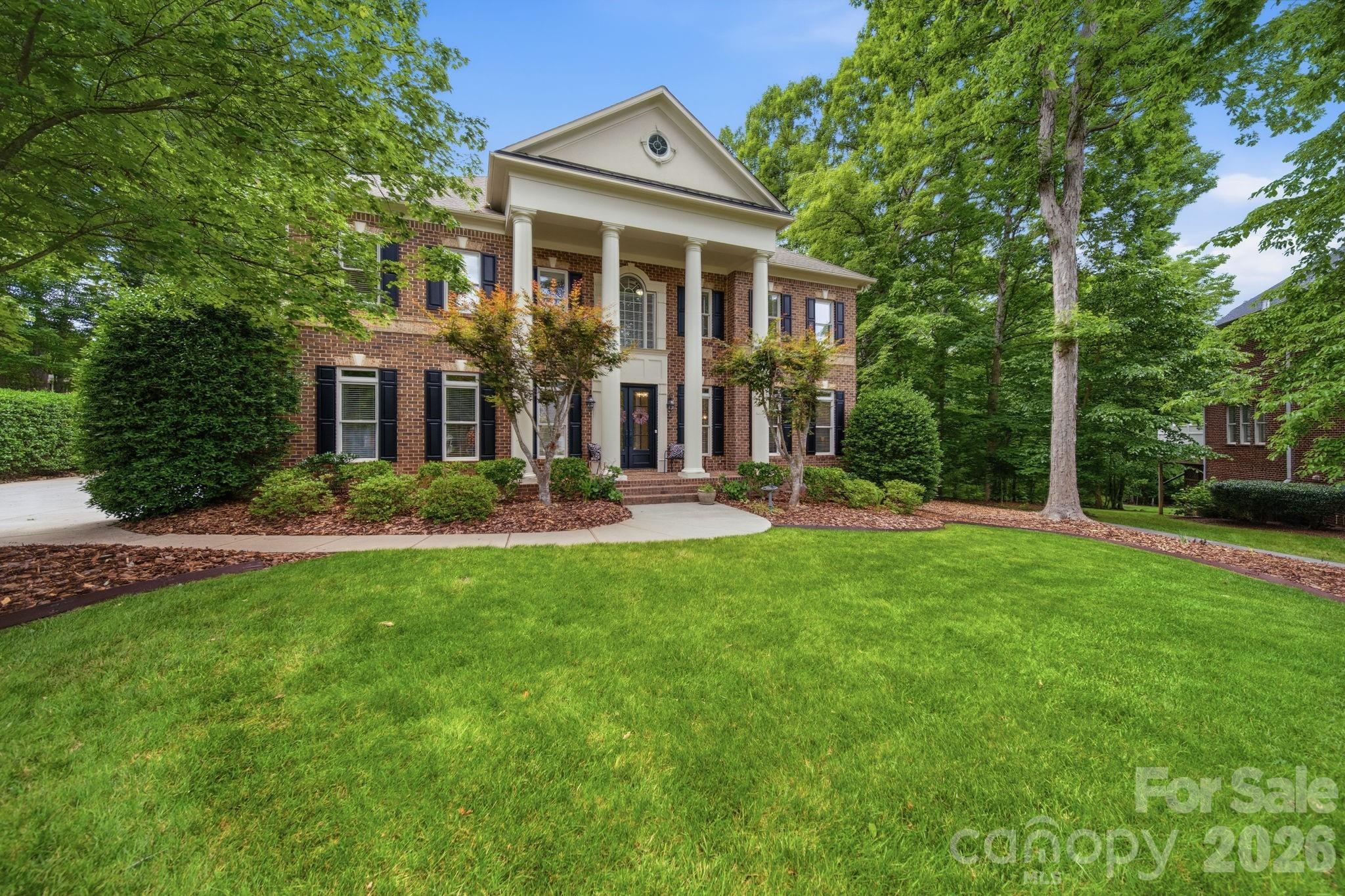 1802 Summit View Place Waxhaw, NC 28173 - Photo 2 of 47 a front view of house with yard and green space