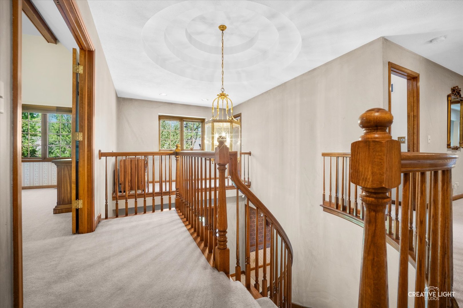 3112 Turnberry Road St. Charles, IL 60174 - Photo 20 of 43 a view of a hallway with wooden floor and stairs