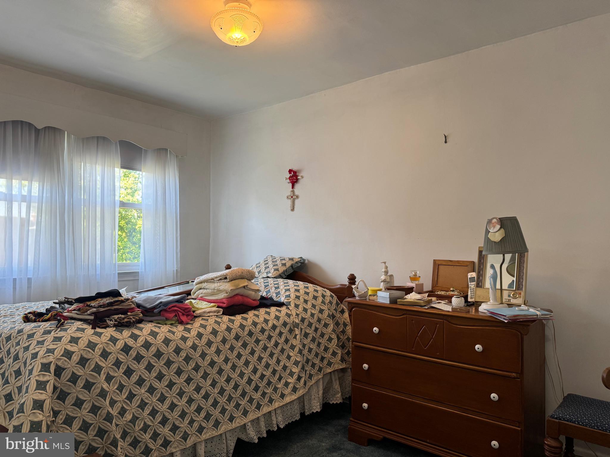 349 Grove Park Road Baltimore, MD 21225 - Photo 11 of 22 a bedroom with a bed and window