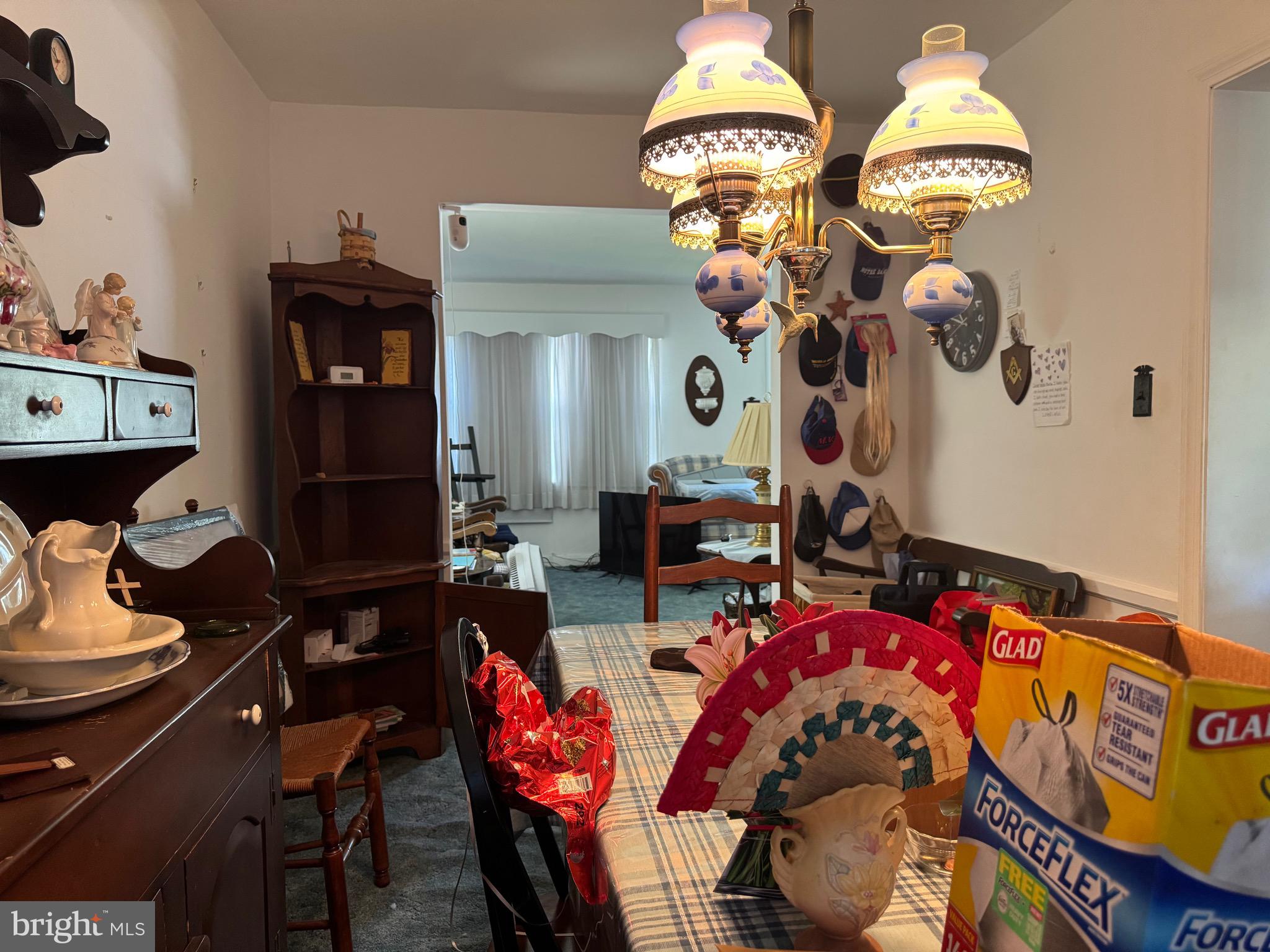 349 Grove Park Road Baltimore, MD 21225 - Photo 6 of 22 a view of a dining room with furniture and chandelier