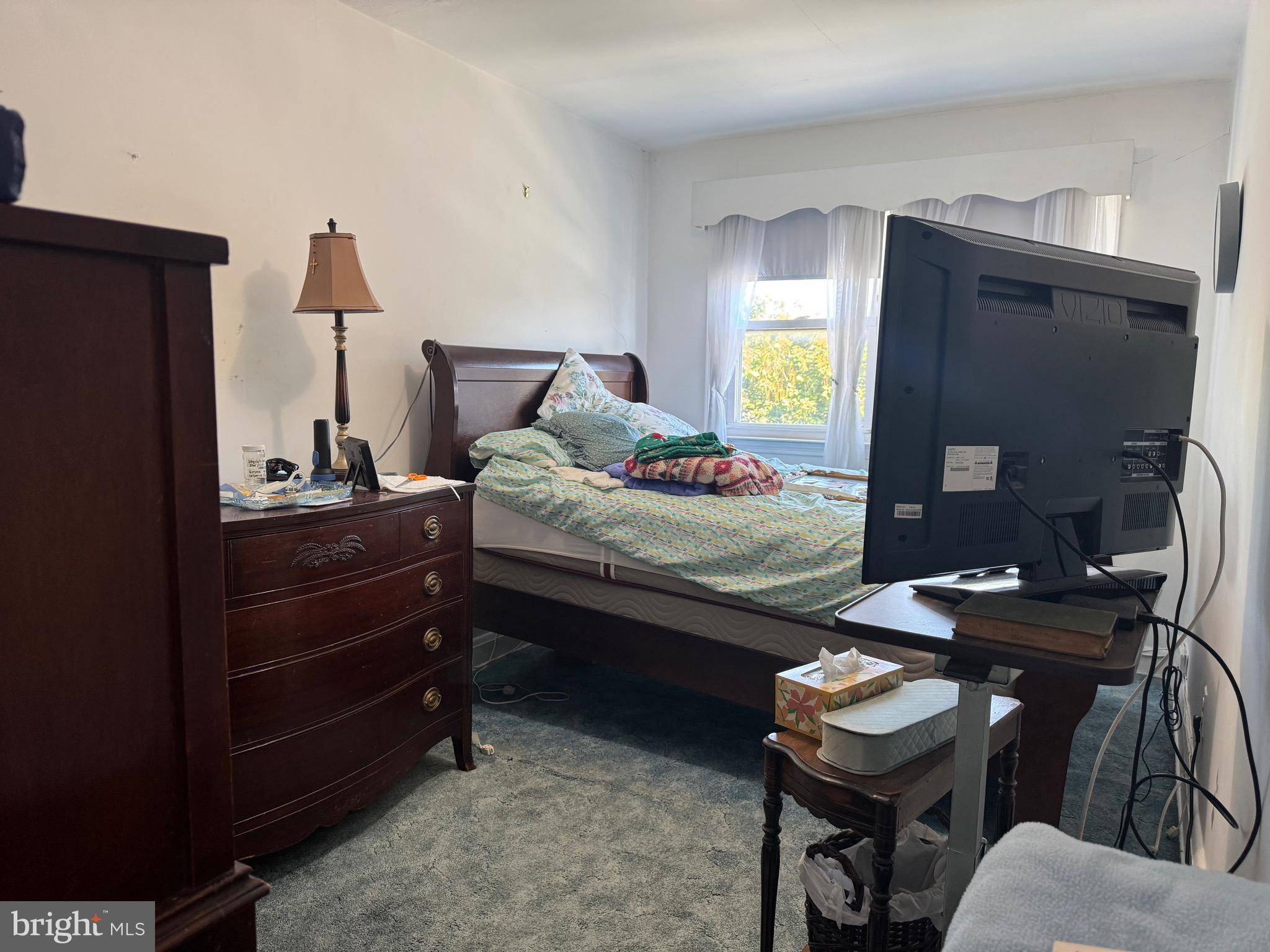 349 Grove Park Road Baltimore, MD 21225 - Photo 9 of 22 a bedroom with a bed and furniture