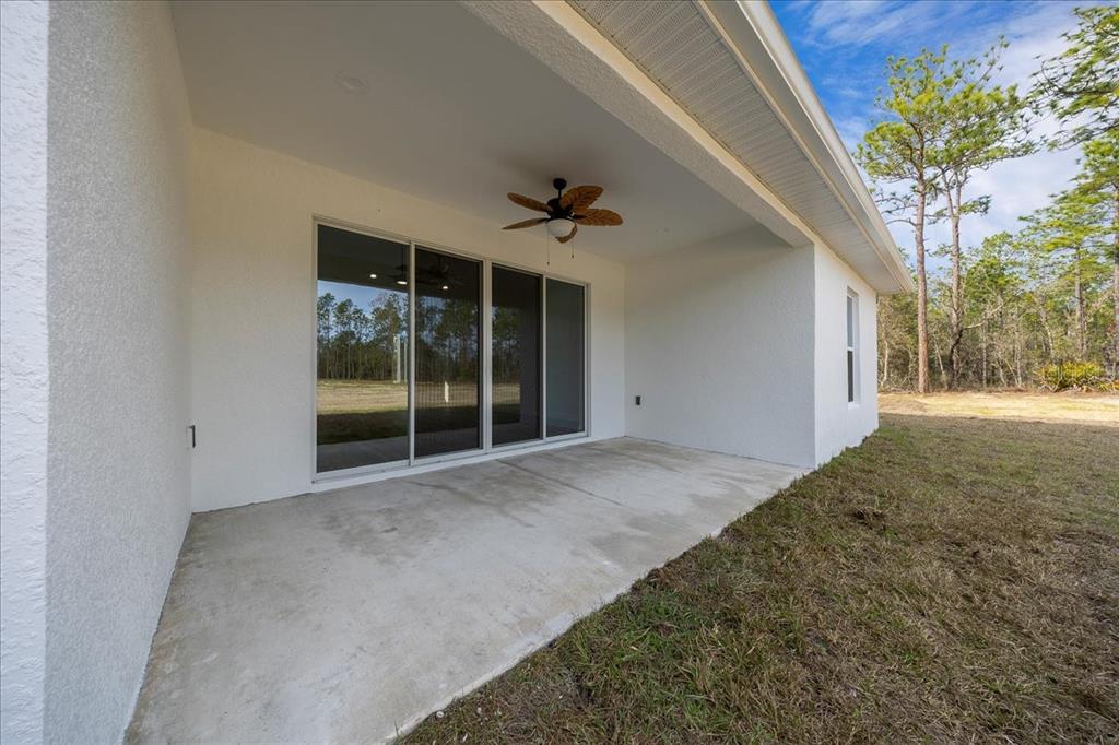 5315 Southwest 121st Terrace Ocala, FL 34481 - Photo 11 of 56 a view of a big room with windows and a ceiling fan