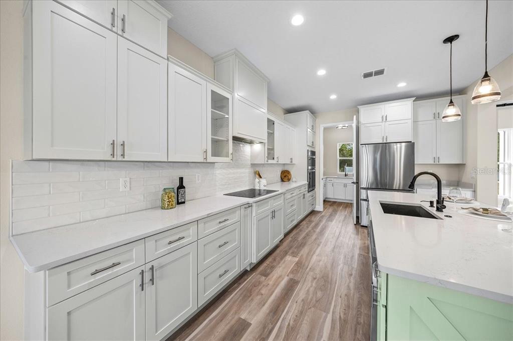 5315 Southwest 121st Terrace Ocala, FL 34481 - Photo 20 of 56 a large kitchen with kitchen island granite countertop a sink stainless steel appliances and cabinets