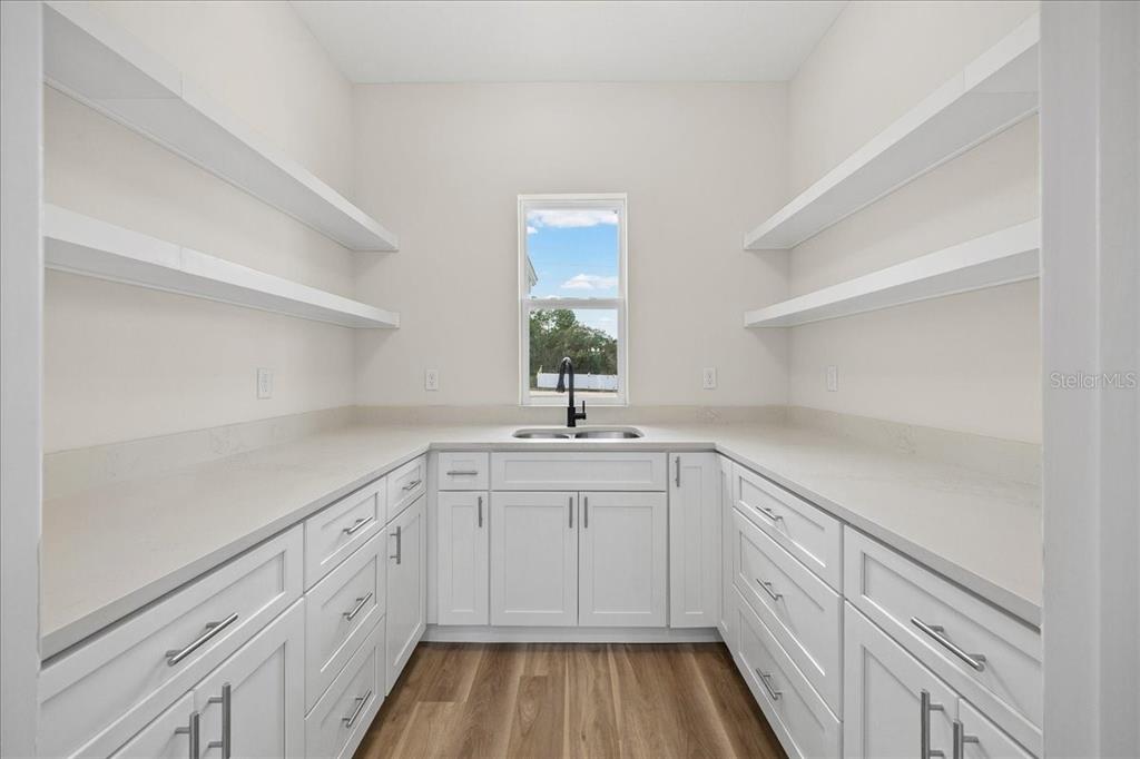 5315 Southwest 121st Terrace Ocala, FL 34481 - Photo 25 of 56 a kitchen with sink cabinets and window