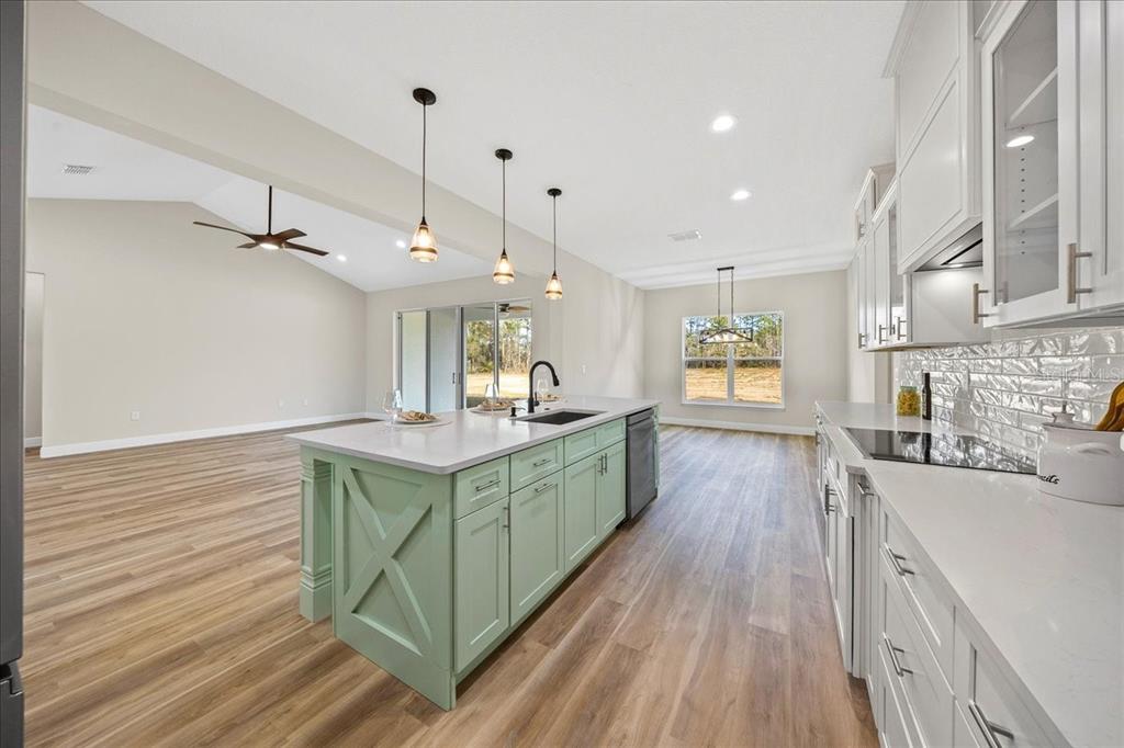 5315 Southwest 121st Terrace Ocala, FL 34481 - Photo 26 of 56 a kitchen with kitchen island granite countertop a sink a counter top space stainless steel appliances and cabinets