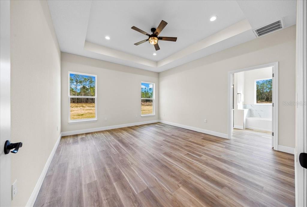5315 Southwest 121st Terrace Ocala, FL 34481 - Photo 32 of 56 wooden floor in an empty room with a window