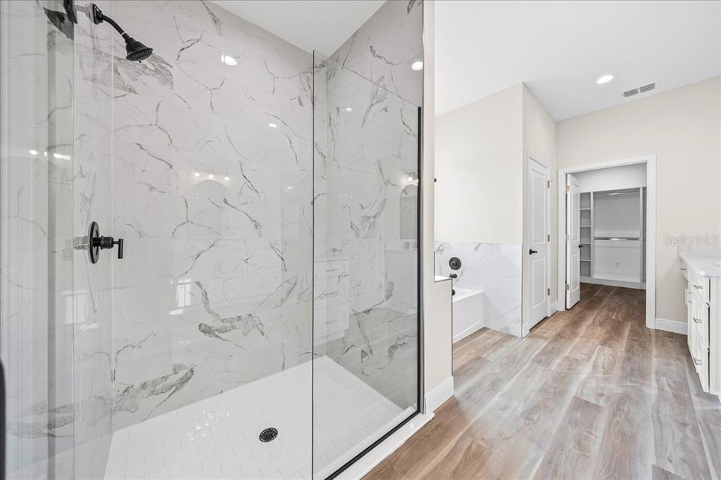 5315 Southwest 121st Terrace Ocala, FL 34481 - Photo 35 of 56 a bathroom with a glass shower door