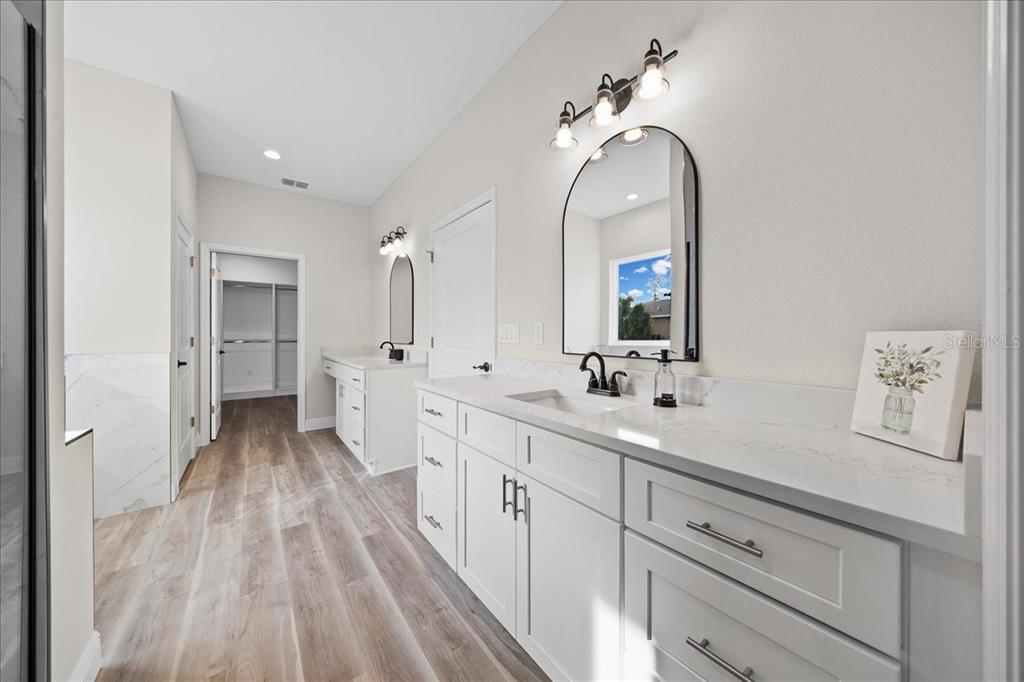 5315 Southwest 121st Terrace Ocala, FL 34481 - Photo 38 of 56 a spacious bathroom with a double vanity sink and a mirror