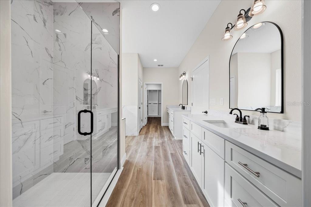 5315 Southwest 121st Terrace Ocala, FL 34481 - Photo 39 of 56 a bathroom with a double vanity sink mirror double and shower