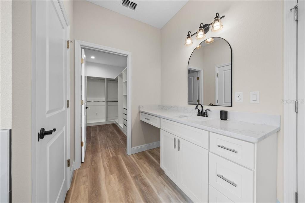 5315 Southwest 121st Terrace Ocala, FL 34481 - Photo 40 of 56 a spacious bathroom with a double vanity sink and mirror