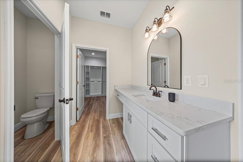 5315 Southwest 121st Terrace Ocala, FL 34481 - Photo 41 of 56 a spacious bathroom with a double vanity sink and mirror