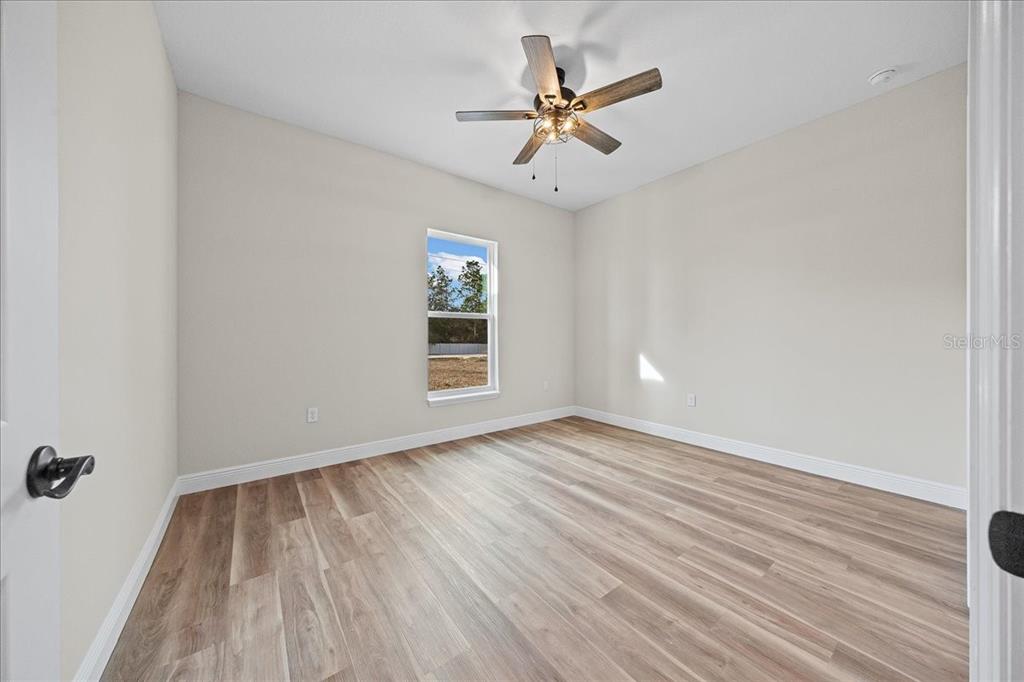 5315 Southwest 121st Terrace Ocala, FL 34481 - Photo 46 of 56 wooden floor in an empty room with a window