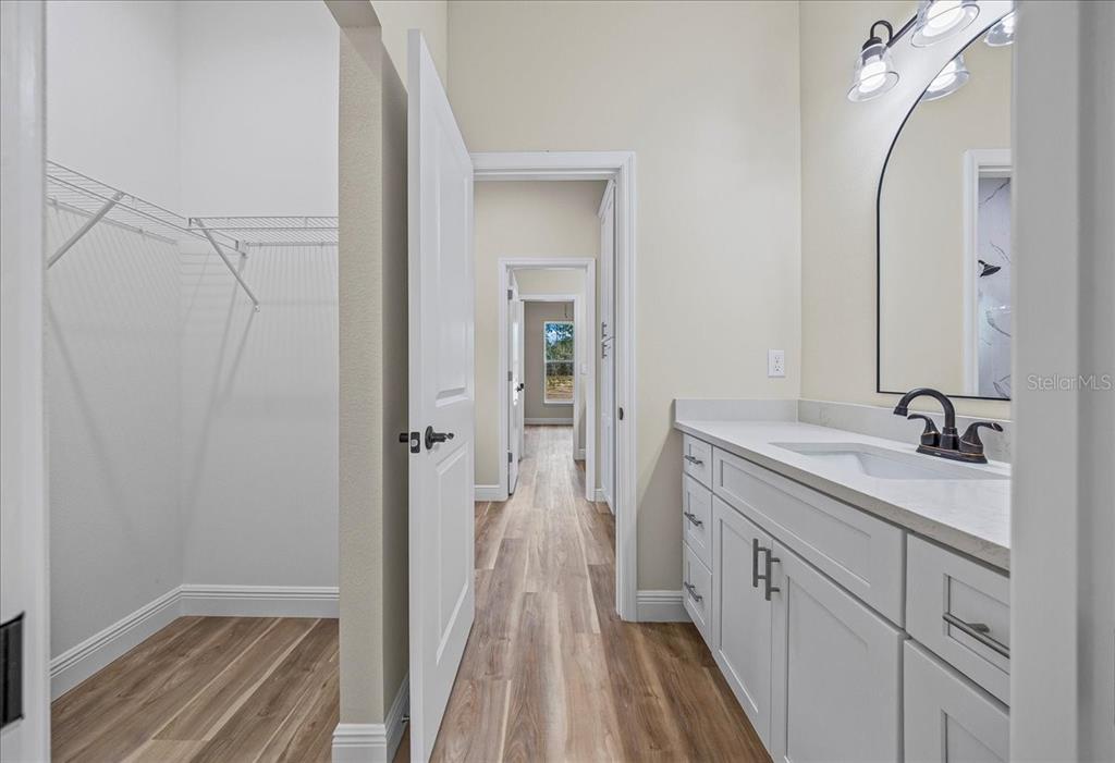 5315 Southwest 121st Terrace Ocala, FL 34481 - Photo 52 of 56 a spacious bathroom with a sink and a mirror