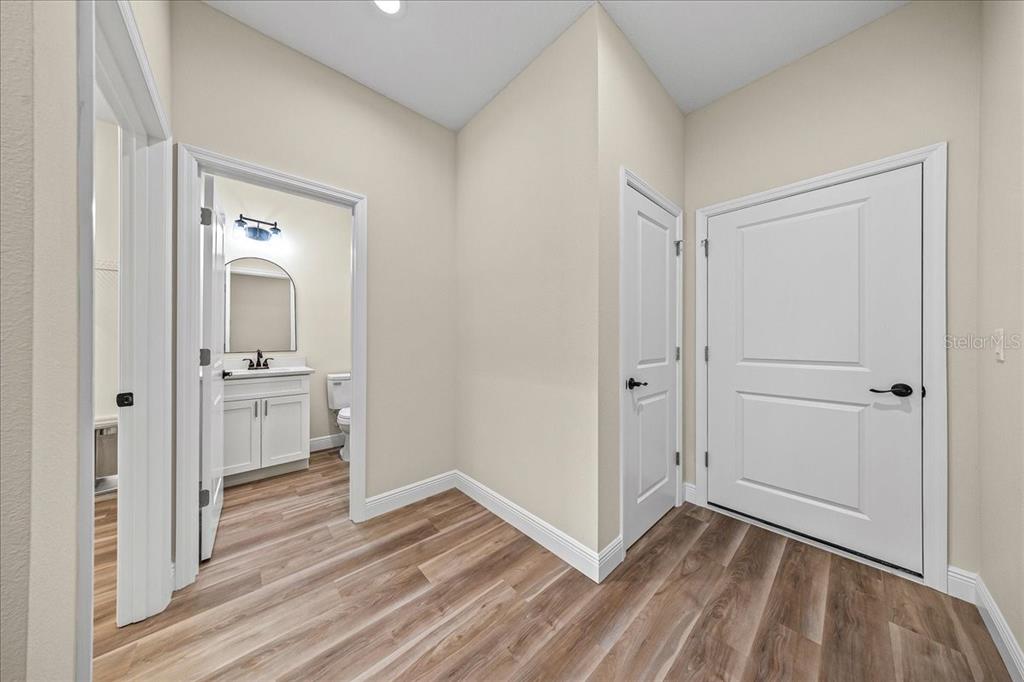 5315 Southwest 121st Terrace Ocala, FL 34481 - Photo 54 of 56 a view of a hallway with wooden floor and closet area