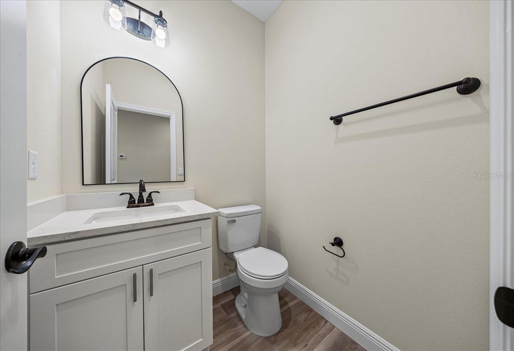 5315 Southwest 121st Terrace Ocala, FL 34481 - Photo 55 of 56 a bathroom with a sink a toilet and a mirror