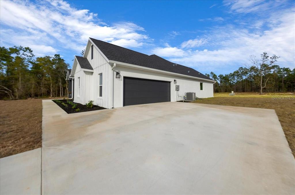 5315 Southwest 121st Terrace Ocala, FL 34481 - Photo 7 of 56 a front view of a house with a yard