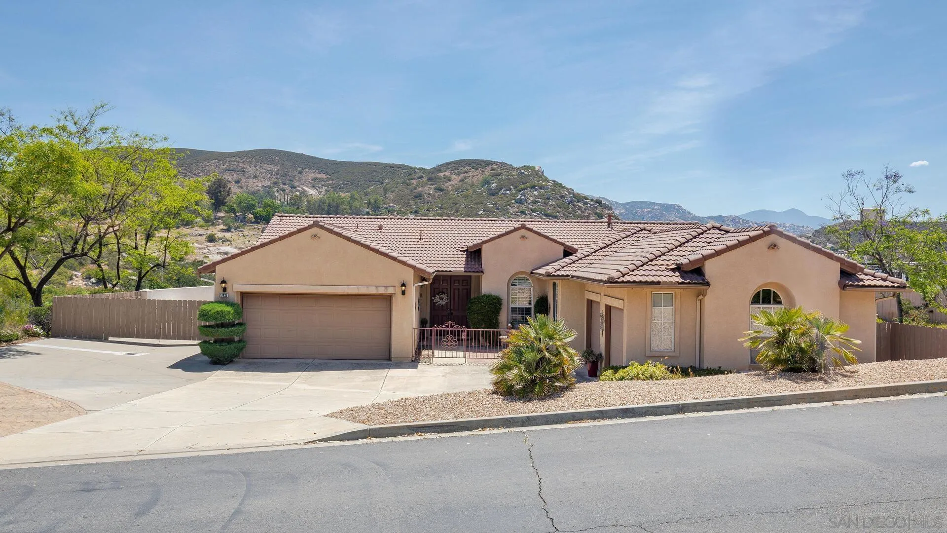 17435 Rising Dale Way Ramona, CA 92065 - Photo 3 of 24 front view of a house and a garden