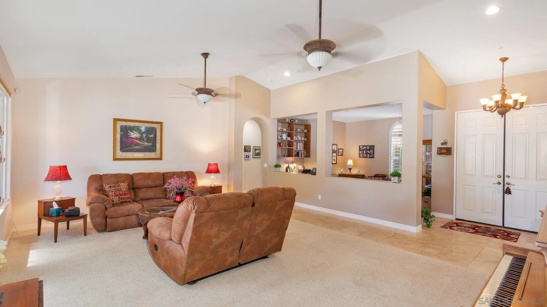 17435 Rising Dale Way Ramona, CA 92065 - Photo 10 of 24 a living room with furniture a chandelier and a chandelier