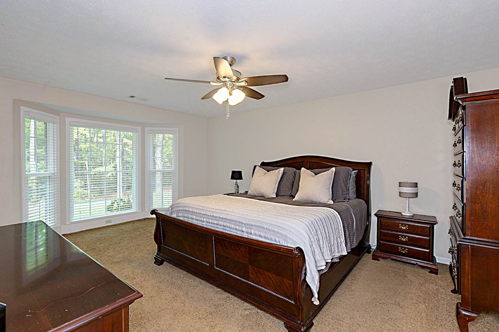 2495 Fortson Road Fortson, GA 31808 - Photo 12 of 30 a bedroom with a bed dresser and a window