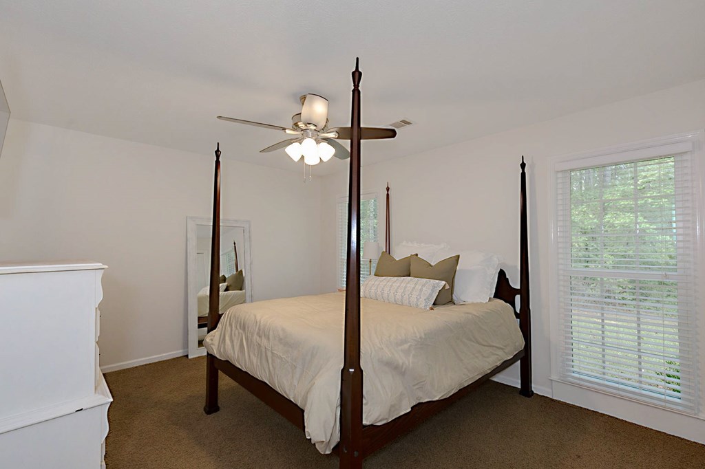 2495 Fortson Road Fortson, GA 31808 - Photo 16 of 30 a bedroom with a bed and a mirror