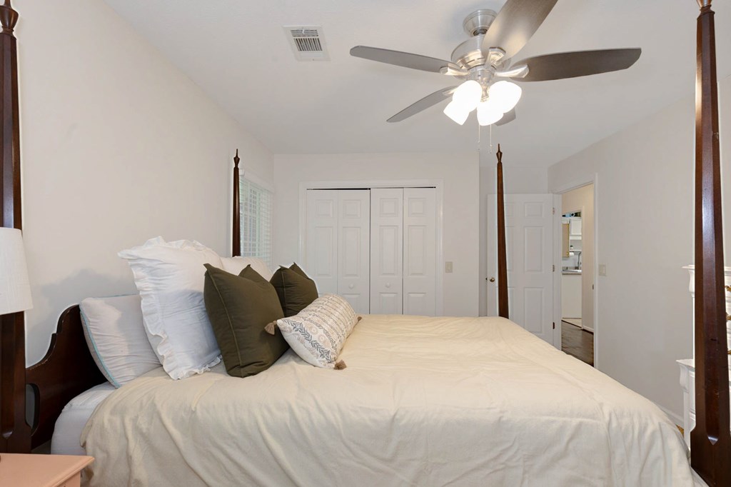 2495 Fortson Road Fortson, GA 31808 - Photo 17 of 30 a bedroom with a bed and a chandelier