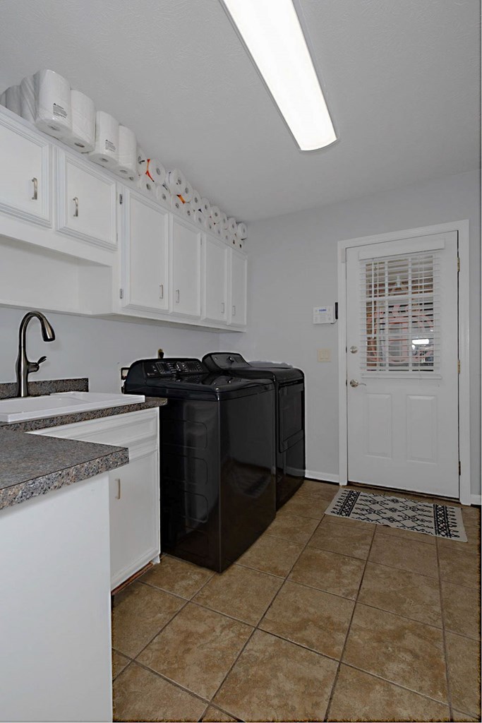 2495 Fortson Road Fortson, GA 31808 - Photo 19 of 30 a kitchen with stainless steel appliances granite countertop a sink stove and cabinets